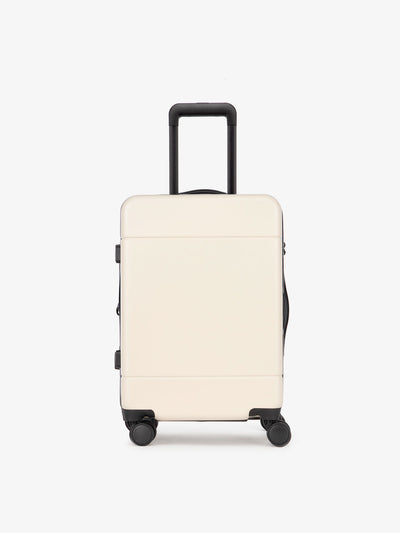 CALPAK Hue hard shell rolling carry-on luggage in linen cream color
