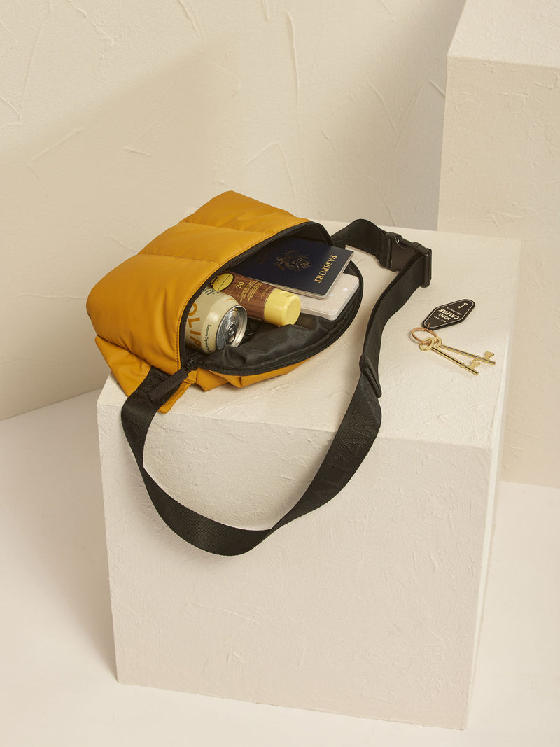 CALPAK Luka fanny pack in yellow dijon color