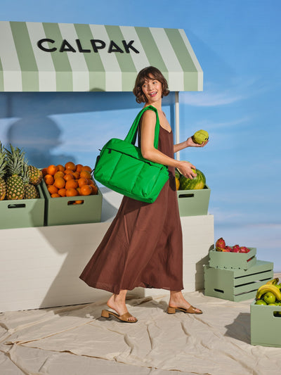 CALPAK Luka Duffel puffy Bag with detachable strap and zippered front pocket in green apple; DSM1901-GREEN-APPLE view 2