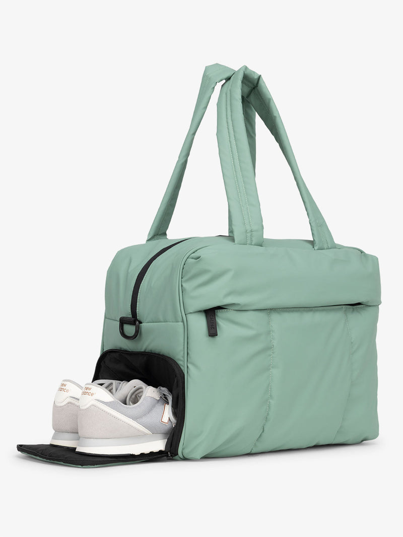 CALPAK Luka Duffel Bag with side shoe compartment and top handles in sage