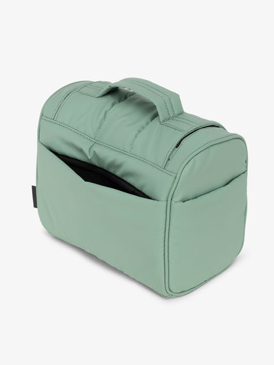 Sage green CALPAK Luka Hanging Toiletry Bag featuring additional secure zippered back pocket