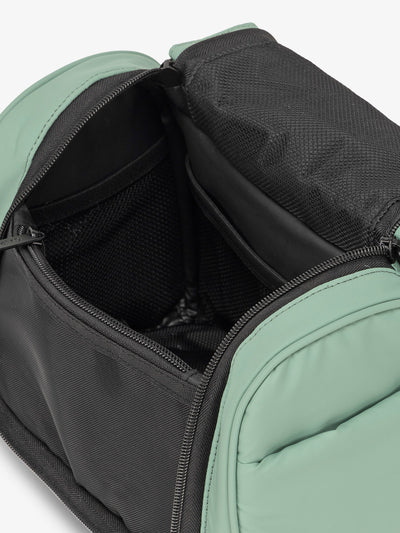 CALPAK Luka Hanging Toiletry Bag with water-resistant lining and mesh pockets for toiletries and makeup in sage green