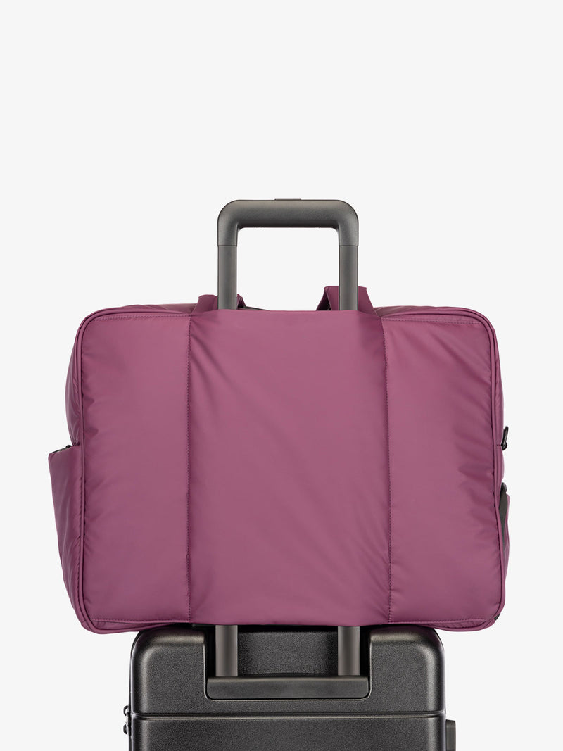 CALPAK Luka large travel duffel bag with trolley sleeve for luggage in purple plum