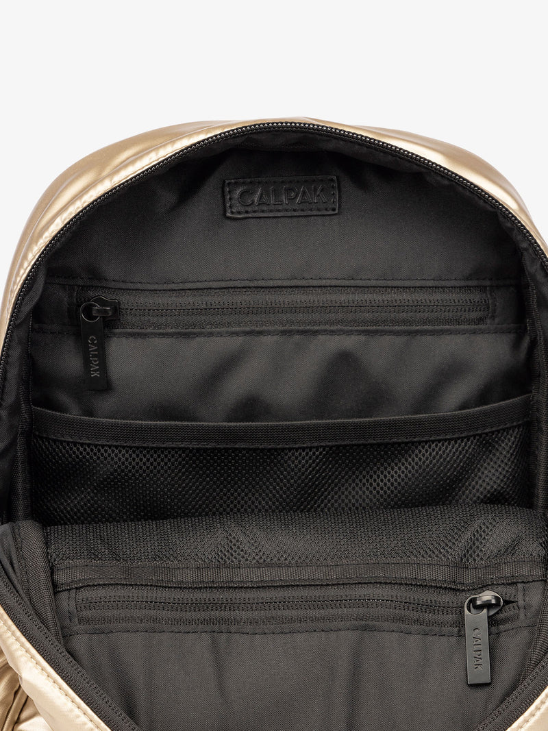 CALPAK Luka Mini travel Backpack with water resistant interior lining and multiple pockets in shiny gold