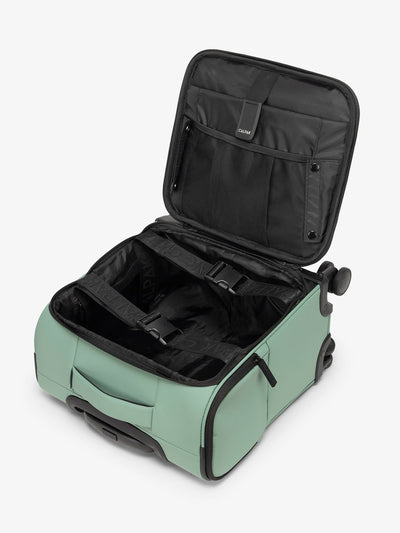 CALPAK Luka mini soft sided carry-on suitcase with laptop compartment and multiple interior pockets in green