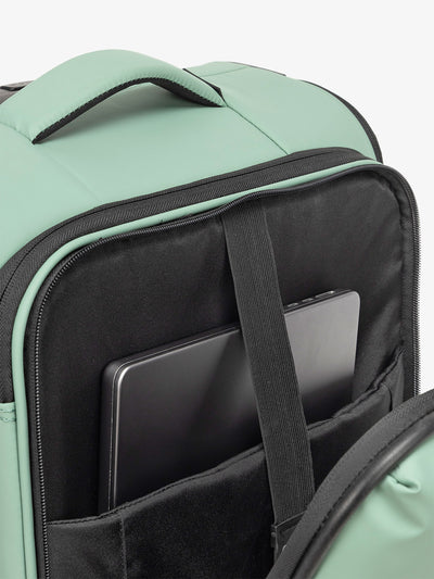 CALPAK Luka soft sided carry on luggage with top handle and padded laptop compartment in sage
