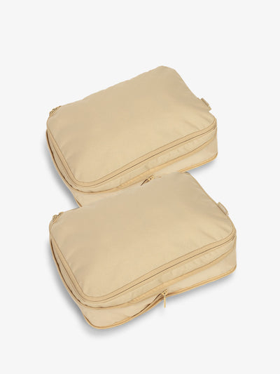 CALPAK compression packing cubes with top handles in beige