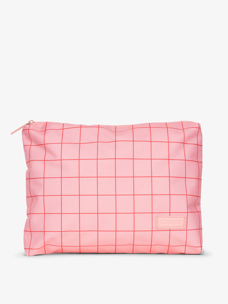 CALPAK water-resistant travel pouch for luggage in pink grid