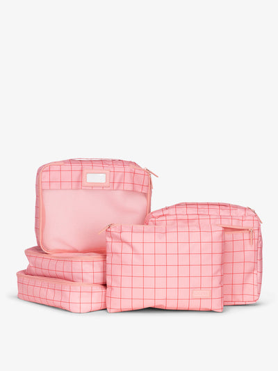 CALPAK 5 piece set packing cubes for travel with labels and top handles in pink grid; PC1601-PINK-GRID view 1