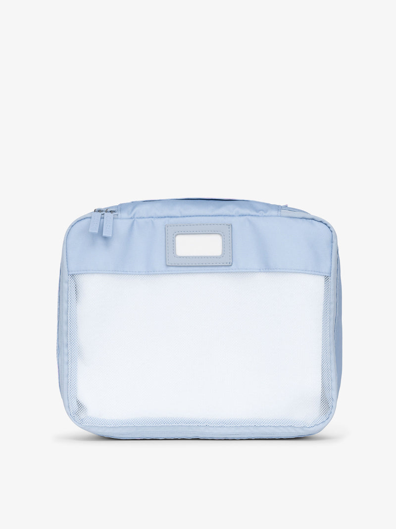 CALPAK luggage packing cubes for clothes with mesh front and label in light blue