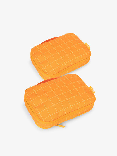 CALPAK small compression packing cubes in orange grid; PCS2301-ORANGE-GRID view 1