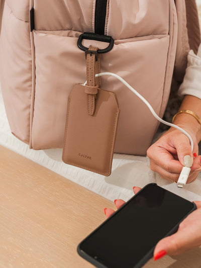 CALPAK Portable Luggage Tag + Charger with USB-C and Lightning adaptor compatibility in caramel; APT2401-CARAMEL view 2