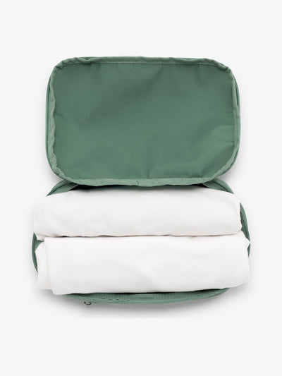 CALPAK small packing cubes for travel made with durable material in sage green