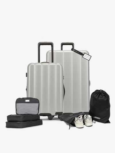 CALPAK Starter Luggage Set with Carry-On, Large Luggage, Packing Cubes, Pouches and Luggage tag in gray smoke; LCO8000-SMOKE view 1