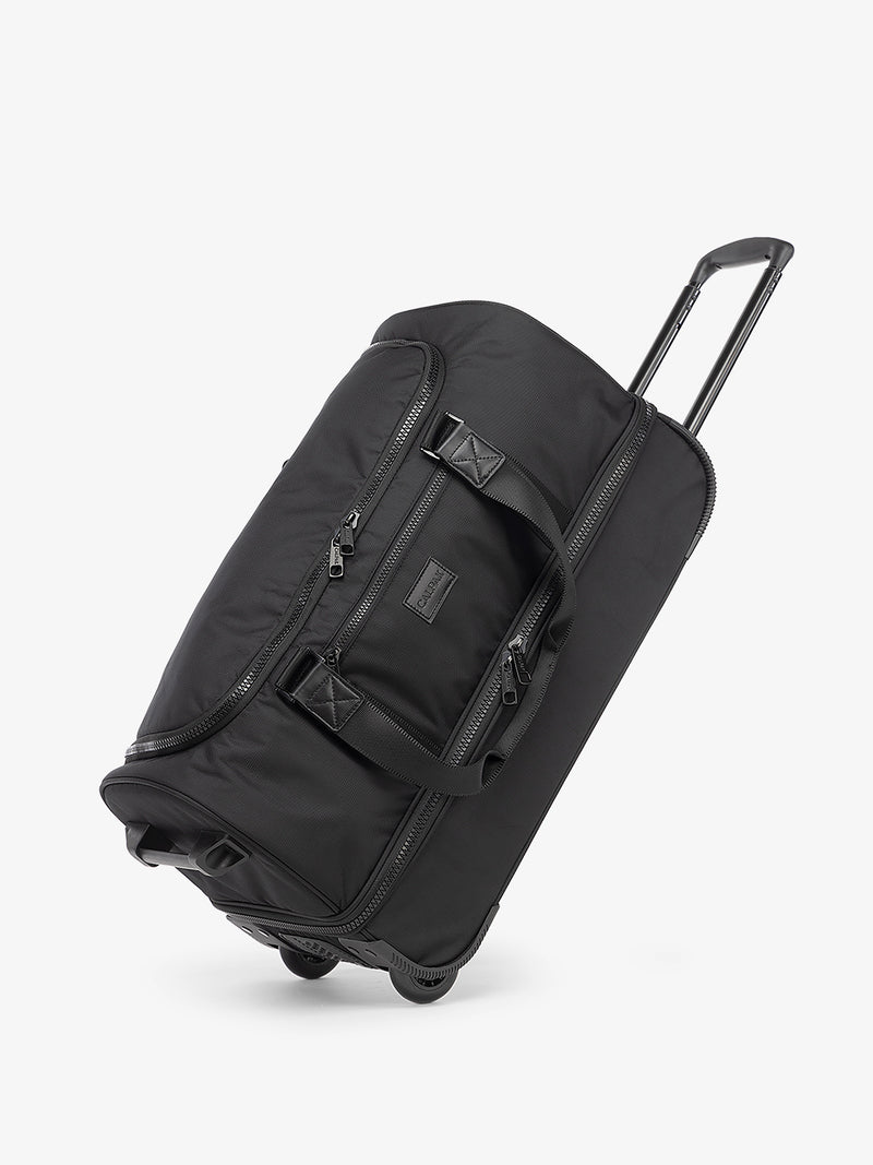 CALPAK Stevyn Rolling Duffel side view in black