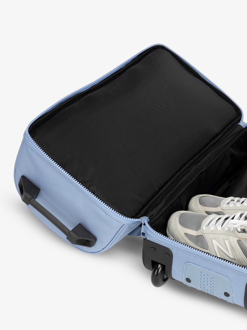 CALPAK Stevyn Rolling Duffle interior of shoe compartment in sky