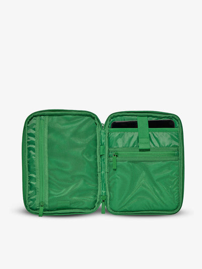 CALPAK Interior of tablet organizer with zippered pockets and padded tablet sleeve in green checkerboard