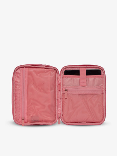 Interior of tablet organizer with zippered pockets and padded tablet sleeve in pink grid by CALPAK