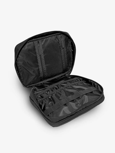 CALPAK Black tablet organizer with multiple pockets for organizing electronics and belongings