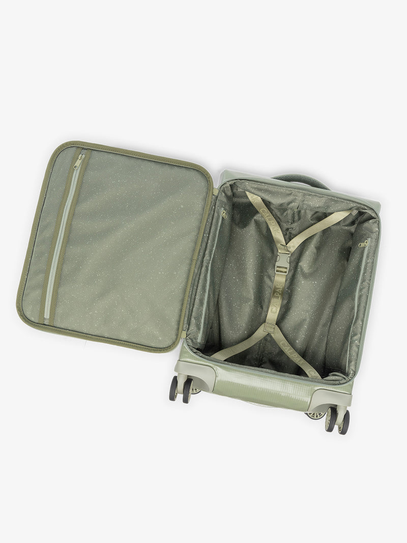 Studio product shot of interior compartment of CALPAK Terra 35L Carry-On luggage with soft shell and 360 spinner wheels in olive green