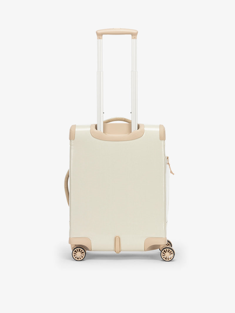 Studio product shot of back-facing CALPAK Terra 35L Carry-On luggage with soft shell and 360 spinner wheels in beige white sands