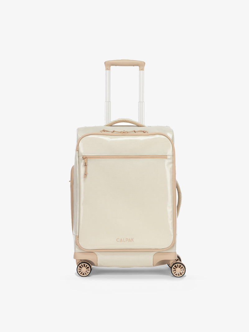 Studio product shot of front-facing CALPAK Terra 35L Carry-On luggage with soft shell and 360 spinner wheels in white sands beige