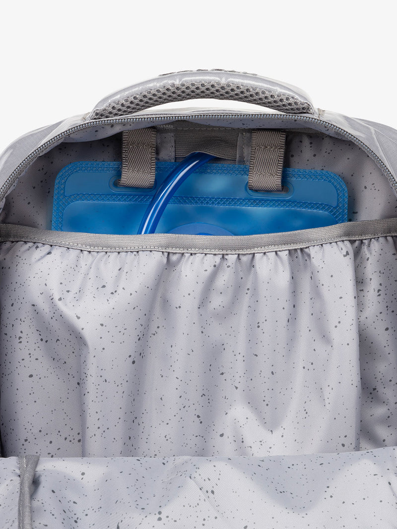 Close up of CALPAK 2L removable hydration reservoir back-slip pocket in storm gray