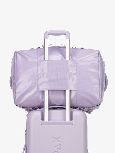 CALPAK Terra Large 50L Duffel Backpack with trolley passthrough in light purple