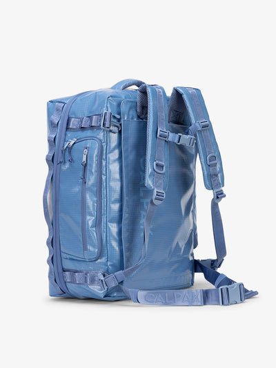CALPAK Terra Large 50L Duffel Backpack with multiple exterior pockets and adjustable sternum strap in glacier