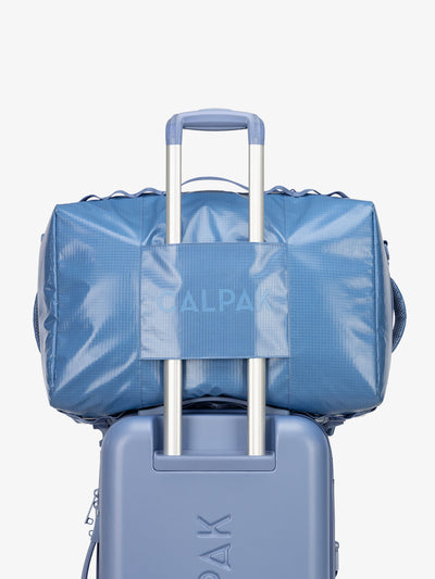 CALPAK Terra Large 50L Duffel Backpack with trolley passthrough in blue glacier