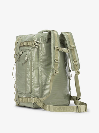 CALPAK Terra Large 50L Duffel Backpack with multiple exterior pockets and adjustable sternum strap in juniper