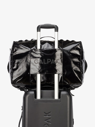 CALPAK Terra Large 50L Duffel Backpack with trolley passthrough in black obsidian