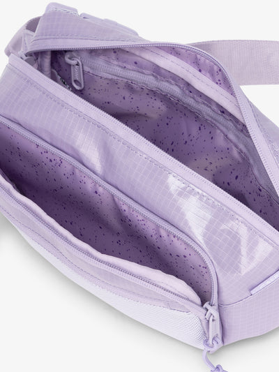 CALPAK Terra hiking belt bag with multiple interior pockets and water resistant exterior in amethyst purple