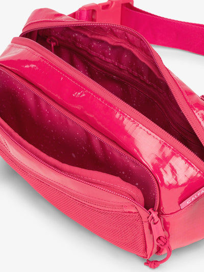 CALPAK Terra hiking belt bag with multiple interior pockets and water resistant exterior in dragonfruit pink