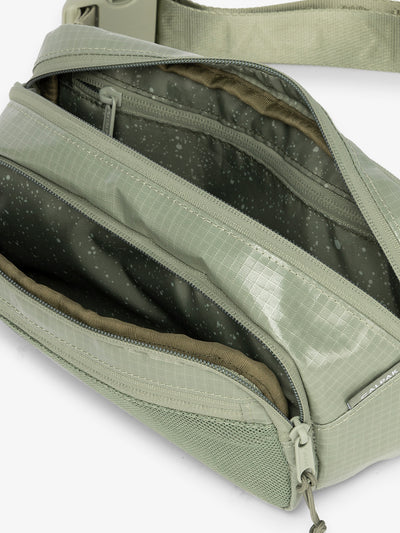 CALPAK Terra hiking belt bag with multiple interior pockets and water resistant exterior in juniper green