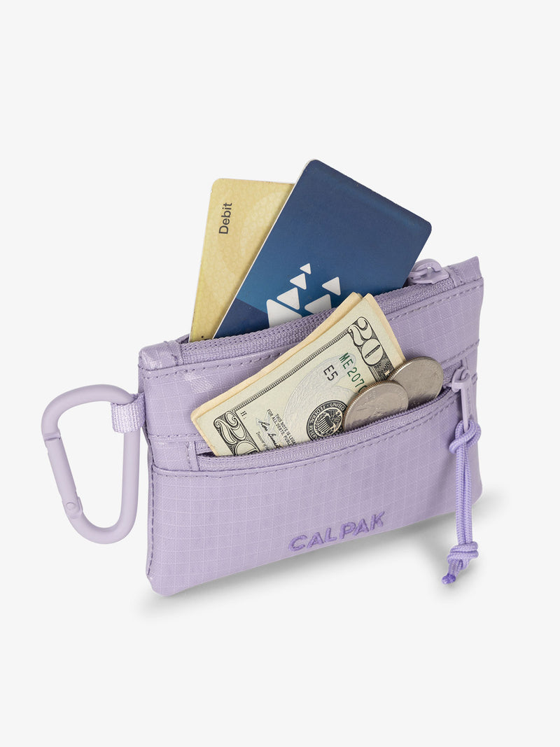 CALPAK Terra Clippable Card Pouch in purple lavender Amethyst being used for card and cash wallet