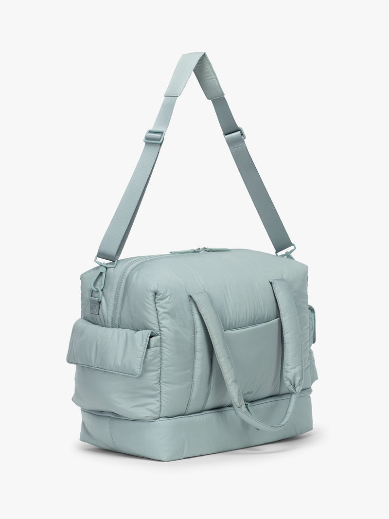 CALPAK Weekender Duffel side view in light blue Bluebell