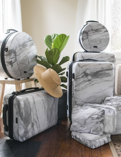 medium size white marble hard shell spinner luggage from CALPAK Astyll collection; LAT1024-MILK-MARBLE view 2