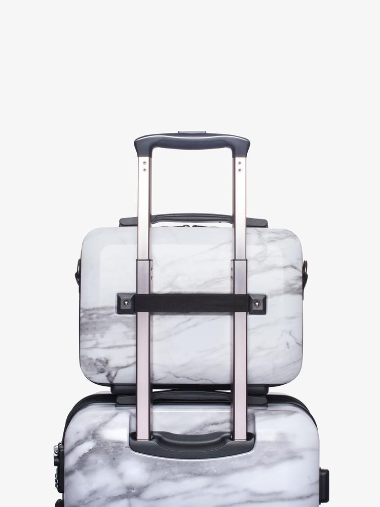 CALPAK white marble vanity case on carry on