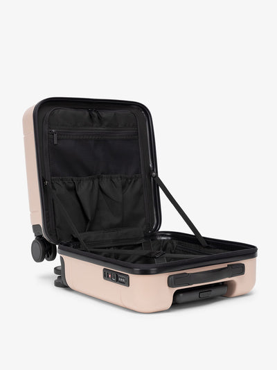 small CALPAK carry on suitcase for travel with compression straps and multiple compartments