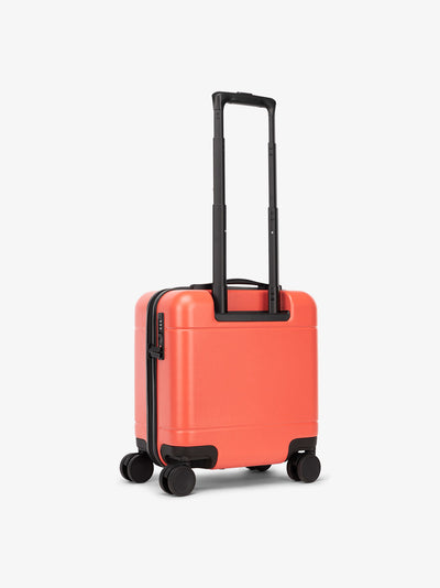 red CALPAK Hue mini carry on luggage with telescopic handle