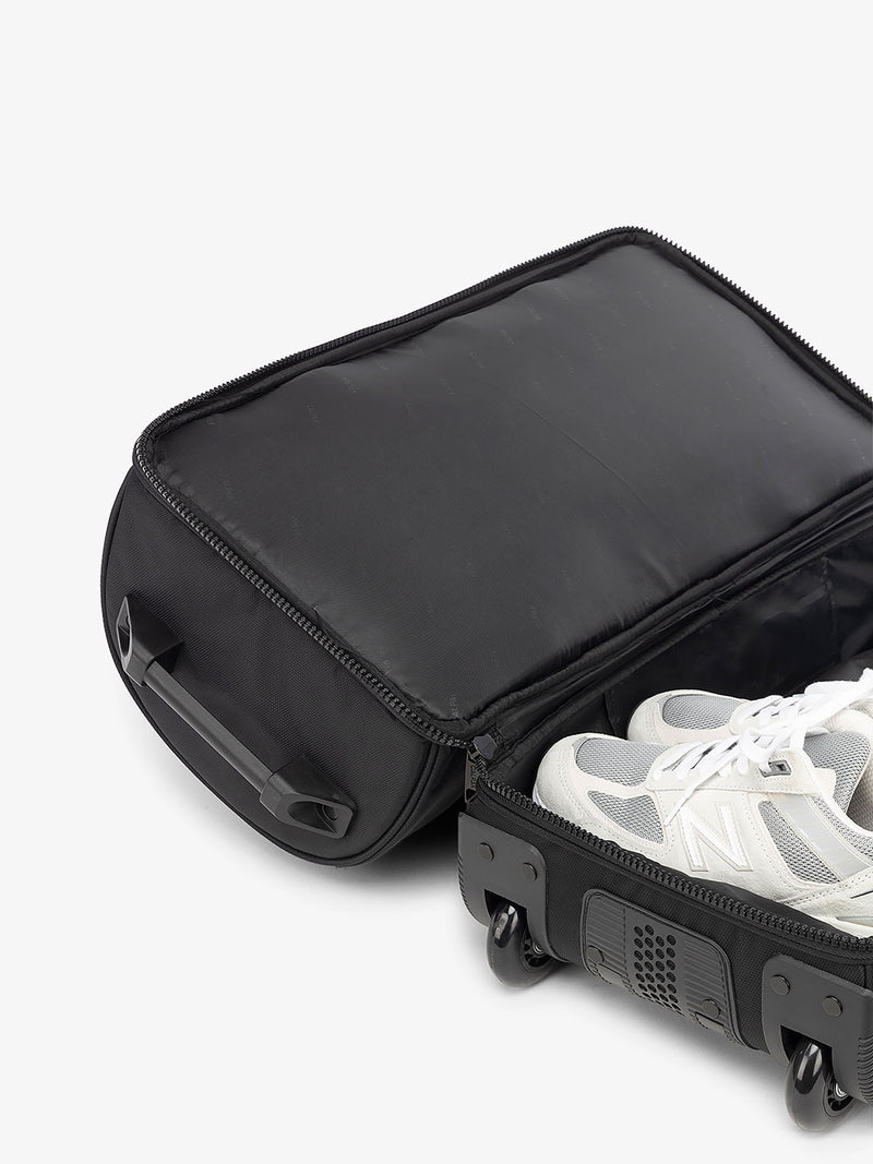 CALPAK Stevyn Rolling Duffle interior of shoe compartment in black